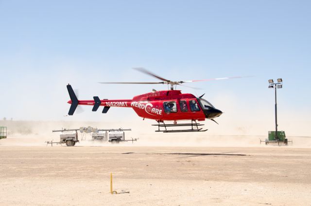 Bell 407 (N429MT) - Aerocare 6, taking off after receiving a patient from Pecos EMS in the deserts in Reeves County, TX.