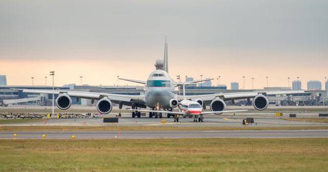 Embraer ERJ-135 (N802AE) - Behind the Embraer is B-LJM of Cathay Pacific Cargo, Boeing 747-867F/SCD