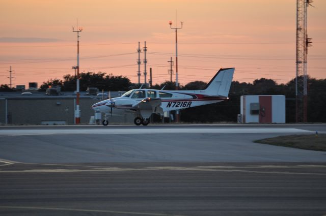 Beechcraft 55 Baron (N7216R) - N7216R landing after the missing man formation for Frank Hailes memorial.