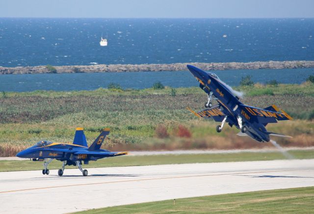 McDonnell Douglas FA-18 Hornet (16-3130) - Going way back to 2008 in my archives. Here is a shot of Blue Angels 163130/#5 pitching up as 162437/#6 continues on at low-level on their take off for their performance on 1 Sep 2008 during the CNAS. I can't believe 163130 hasn't been highlighted here until now.