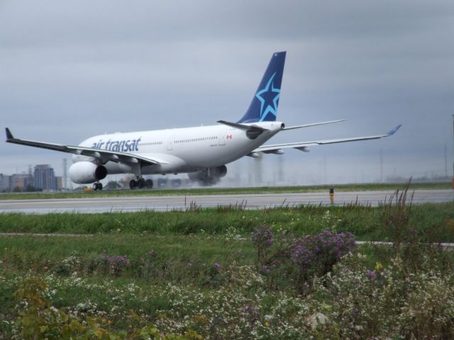 Airbus A330-200 (C-GTSR) - Take off power set as she rolls along 06L at CYYZ