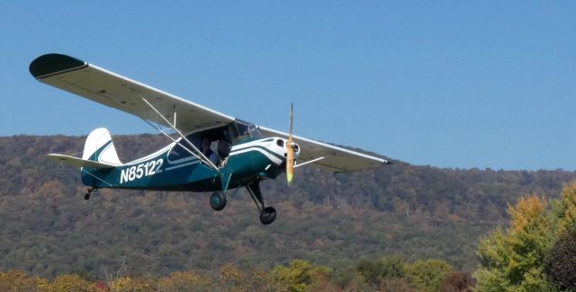 CHAMPION Tri-Traveler (N85122) - On short final near a section of the Kittatinny Ridge of the Appalachian Mountains is this 1946 Aeronca 7AC Champion Tri-Traveler in the Autumn of 2022.