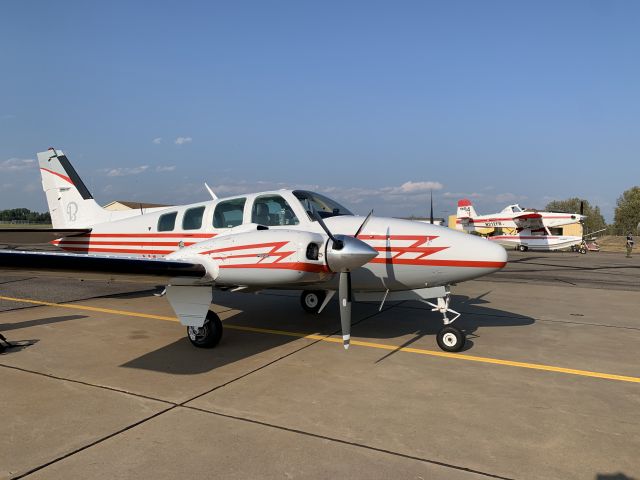 Beechcraft Baron (58) (N14AJ) - N14AJ and Fire Boss 204