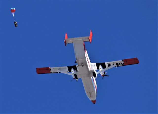 Short 330 (N161Z) - KO85 Benton Airpark Redding CA Oct 2019 Benton Air Faire set to start with the Star Spangled Banner with USFS Jumper 1 on the E Ticket ride with Jumper 2 at the Port exit door awaiting his turn. This was an excellent demonstration team and jumping in strong winds I bet is no fun working the LZ from above. The Redding based USFS Sherpa made several flyovers before allowing Jumper 1 and 2 to thrill the large crowds. I have several photos posted under Benton Air Park Google maps photo section Redding.