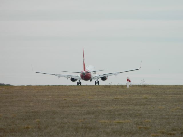 Boeing 737-700 — - Melbourne International Airport standing at the start of runway 34 waiting for this 737-800 to take off.