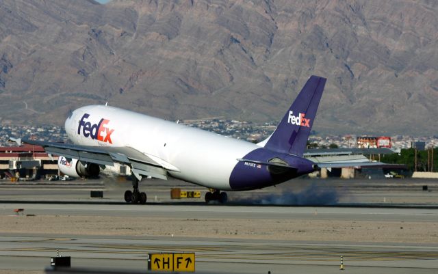 Airbus A300F4-600 (N675FE) - KLAS - Apr 2nd, 2005 shows FedEx Airbus smokin 1L late Pm at Las Vegas on this windy day.