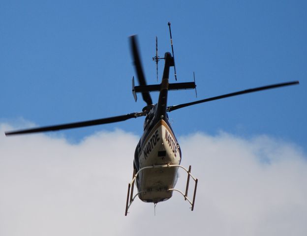 Bell 407 (N407DE) - DUKE ENERGY INDIANA INC / Crossing over departing traffic on runway 18C - 10/20/10