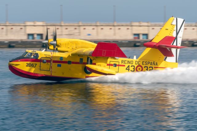 Canadair CL-41 Tutor (UBD1402) - Photo taken in the Port of Santa Cruz de Tenerife to this Bombandier CL-415 plane of the Spanish air force, carrying out water loading maneuvers to put out the fire that is raging in the north of the Island of Tenerife in the Canary Islands with register UD.14-02 and msn 2067