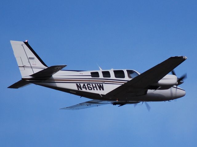 Beechcraft Baron (58) (N46HW) - Departing from runway 02 at Concord Regional Airport - 2/23/09