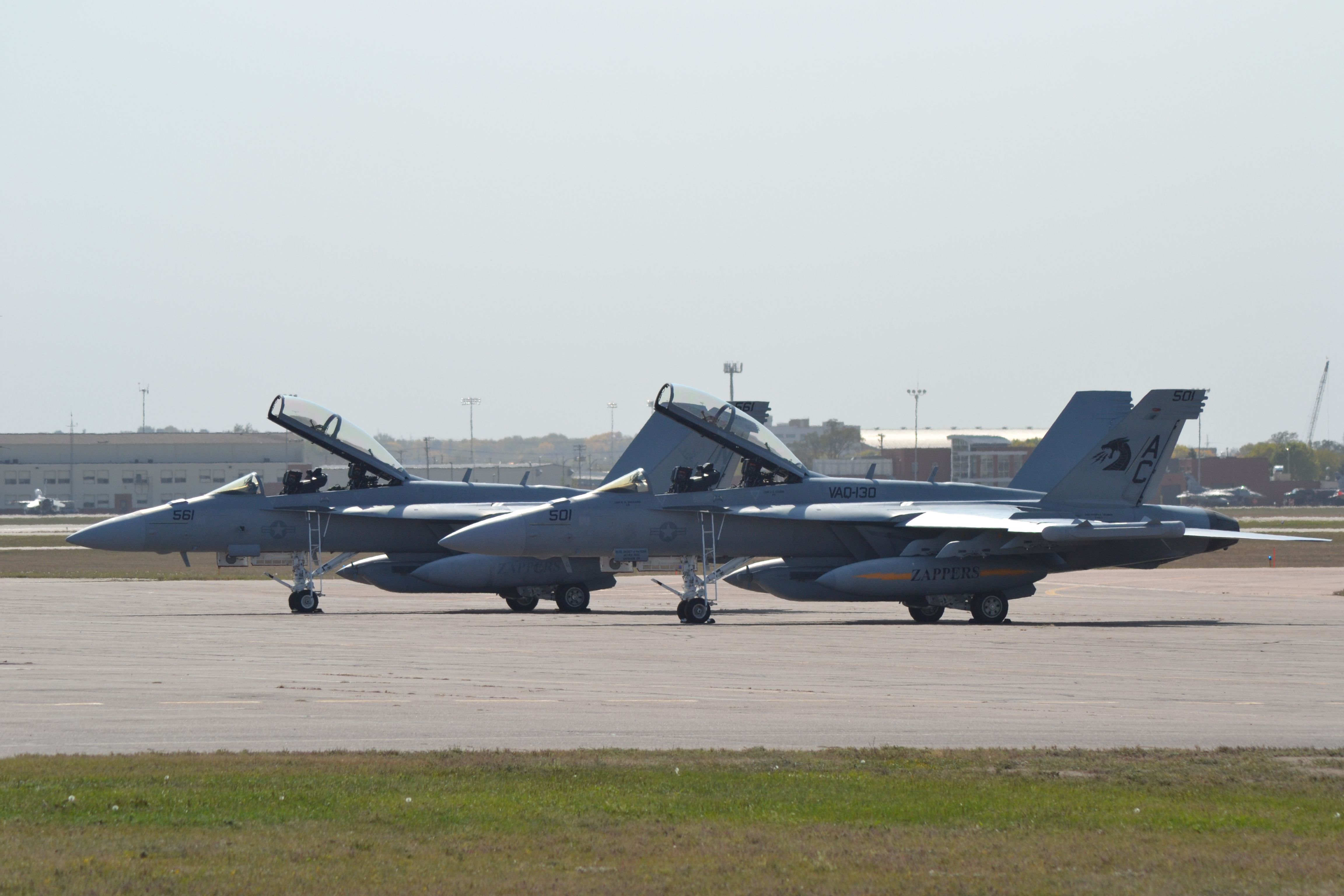 — — - 2 EA-18G's assigned to VAQ-130, CAW3 (Carrier Air Wing - 3) aboard USS Harry S Truman, stationed at NAS Whidbey Island sitting on the General Aviation tarmac in FSD