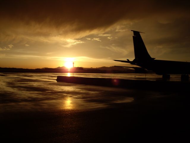 — — - Sunset after a summer rainstorm at the Salt Lake City Airport.