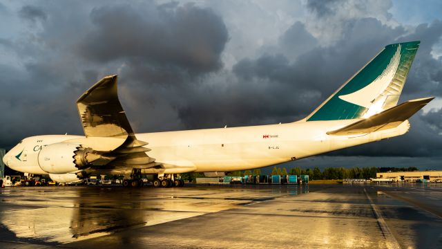 BOEING 747-8 (B-LJL) - Heavy rain and thunder storms in the distance. Fresh rain on the ground during golden hour? Perfection.