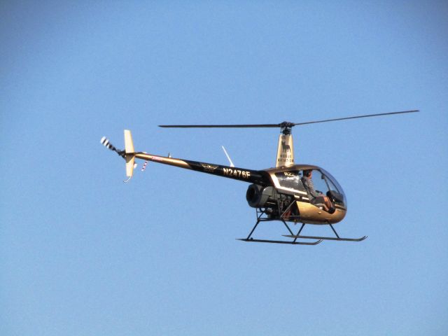Robinson R-22 (N2476F) - Lifting off from KSNA