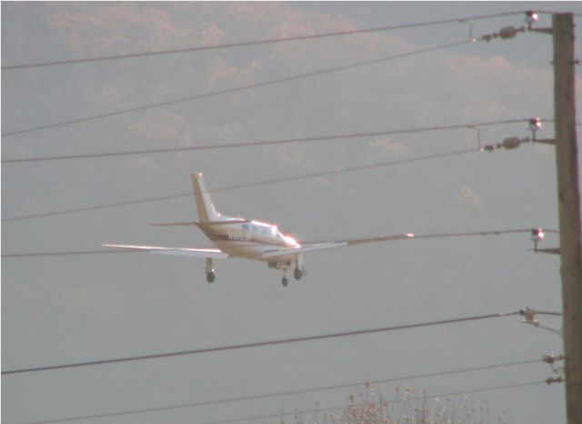 Piper Malibu Mirage (N818JP) - Landing.  This airplane pic is really hard to get.