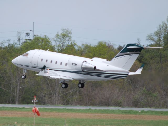 Canadair Challenger (N1M) - Departing runway 02 KJQF - 4/7/09 (Update 12/17/10 - appears to now be registered as N42EE)