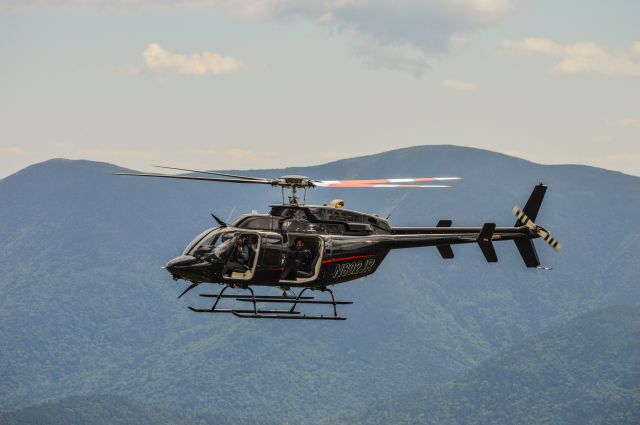 Bell 407 (N802JR) - Shot taken at the 2017 Climb to the Clouds Hillclimb that takes place up the Mt Washington Auto Road in the White Mountains of New Hampshire. br /The Bell in the shot is being used by the Subaru of America Factory Team to record footage for their web series, Launch Control.br /Shot with a Nikon D3200 w/ Nikkor 70-300mmbr /Best viewed in Full Size