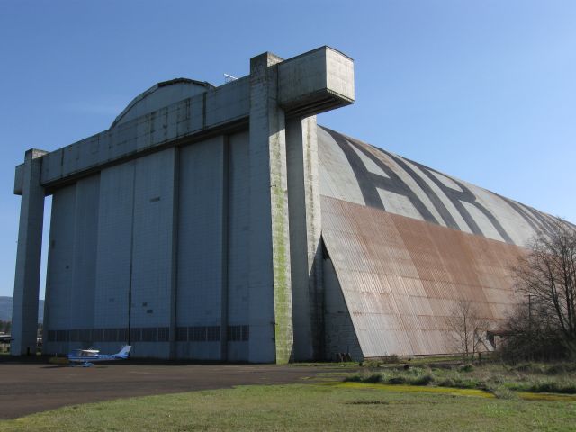 Cessna Commuter (N3265J) - John Twiss' 1967 C150 in front of the old blimp hangars at Tillamook, OR in 2009. 
