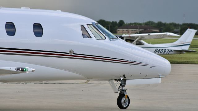 Cessna Citation Excel/XLS (N575QS) - “Execjet 575” pulling out of the FBO after being diverted from MDW due to weather/fuel (said weather in background). br /br /EJA575. N575QS. 2007 Cessna 560XL Citation XLS. NetJets. KVPZ. 5/31/23. 