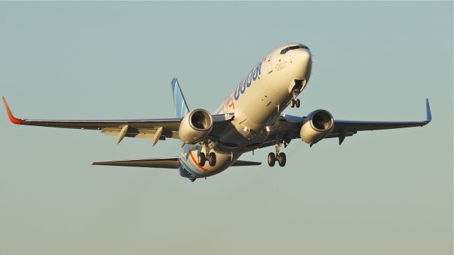 Boeing 737-800 (A6-FDW) - BOE14 in FLY DUBAI livery has the distinction of being the 7000th Boeing 737 built. Here it makes a touch/go landing on runway 16R on 12/9/11.