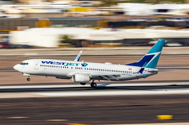 Boeing 737-800 (C-FXMS) - A WestJet 737-800 landing at PHX on 2/28/23. Taken with a Canon R7 and Canon EF 100-400 L ii lens.