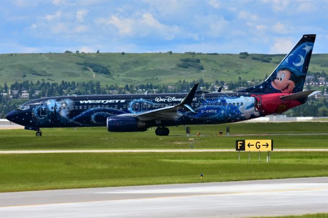 Boeing 737-800 (C-GWSZ) - WestJet (Disney's Micky Mouse Livery) Boeing 737-8CT departing YYC on June 30.