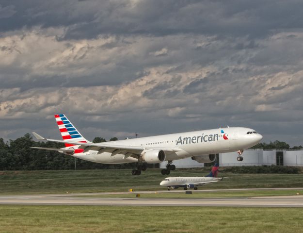 Airbus A330-300 (N270AY) - KCLT with some storms brewing up North from the field