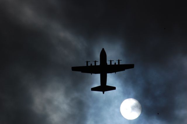 Lockheed C-130 Hercules — - C-130 over head, the clouds and the sun and the airplane all were in the right spot.