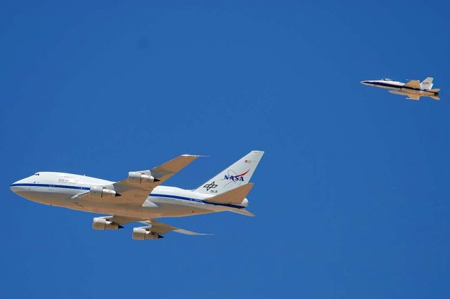 BOEING 747SP (N747NA) - NASA Boeing 747SP-21 N747NA Clipper Lindbergh over the town of Boron California on its delivery flight to Edwards Air Force Base on May 31, 2007. The Boeing 747SP was modified to carry a 2.5 meter diameter infra-red telescope as the Stratospheric Observatory for Infrared Astronomy (SOFIA).  It was escorted on the approach to Edwards by NASA McDonnell-Douglas F/A-18B Hornet N846NA. 