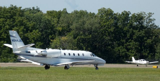Cessna Citation Excel/XLS (N844JS) - On the departing paved runway is this 2003 Cessna Citation 560XLS in the Summer of 2021.