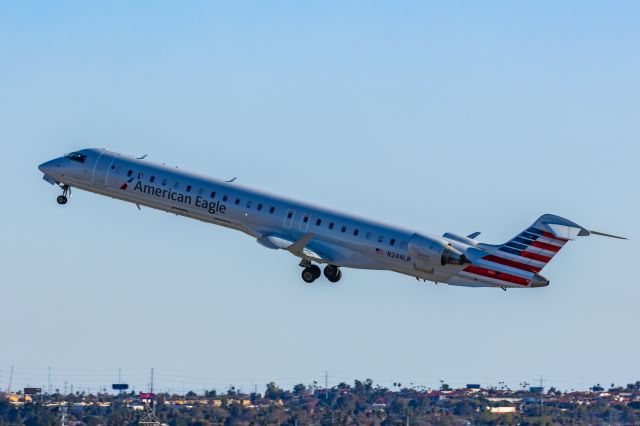 Canadair Regional Jet CRJ-900 (N244LR) - A Mesa Airlines CRJ900 taking off from PHX on 2/12/23 during the Super Bowl rush. Taken with a Canon R7 and Canon EF 100-400 II L lens.