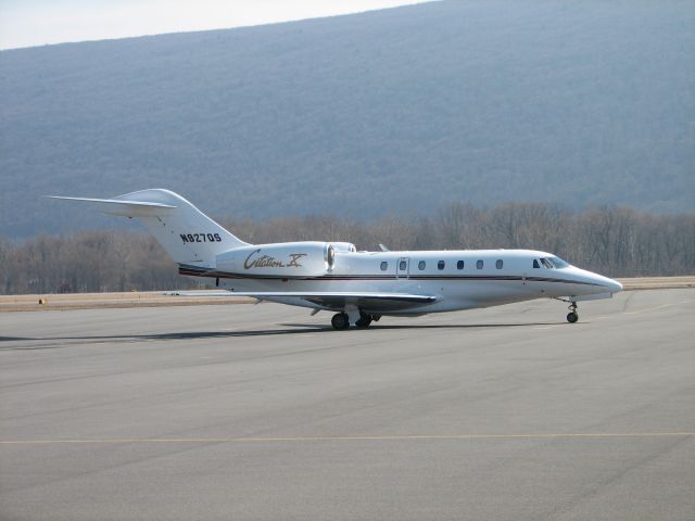 Cessna Citation X (N927QS) - Waiting patiently on the GA Ramp.