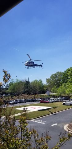 Eurocopter AS-350 AStar (N126LN) - Looking outside the window to the parking lot. Amazing!