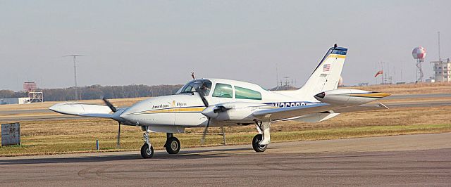 Cirrus SR-22 (N3696G) - An American Flyers Cessna 310 taxis to the ramp.