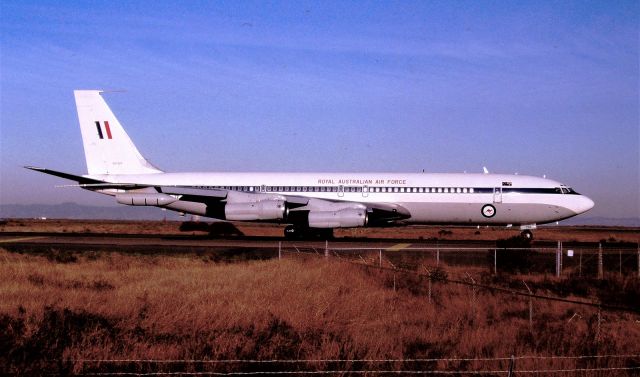 Boeing 707-100 (A20624) - KSFO - RAAF Boeing 707-300 series A20-624 ex Qantas Airliner on slow taxi to Runway 1R at San Francisco. This is an early 1990s photo taken from the old dirt parking lots adjacent 1R taxiway to hold bars. This jet retired in 2008. I took a series of 36 photos as this jet was pushed back from the Terminal, and slow taxi to this point here. This was the only time I saw this jet and I was about to leave SFO and head back to SJC area when I spotted this tail. I waited!