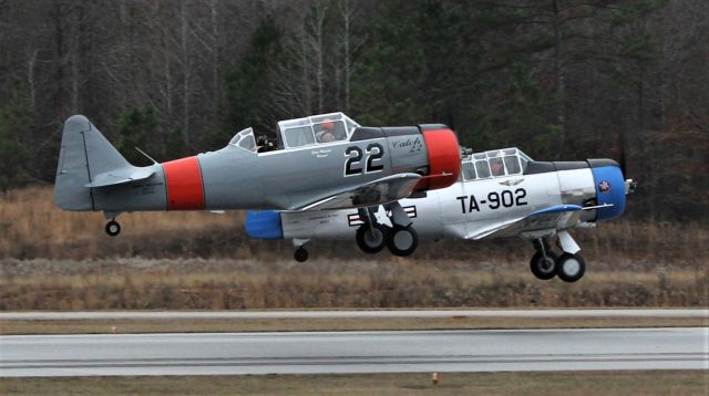 North American T-6 Texan (N22KD) - A flight of two T-6's, N22KD and N103LT takes off on runway 31 at Falcon Field-Peachtree ity, Ga.