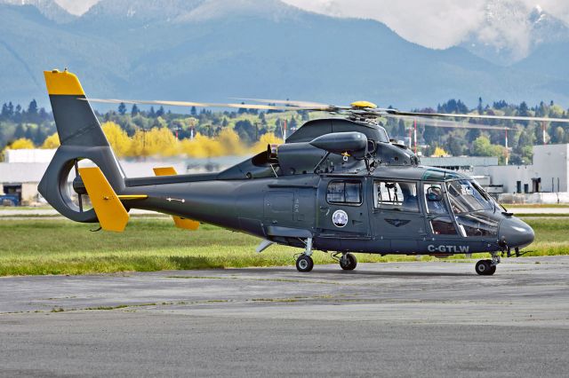 C-GTLW — - Now with a "North Shore Rescue" sticker. The mountains in the background of this photo is the North Shore of Vancouver.