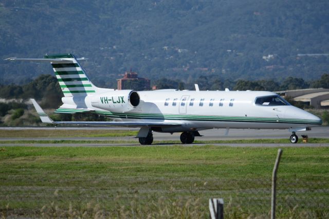 Learjet 35 (VH-LJX) - On taxiway heading for take-off on runway 05. Wednesday, 21st May 2014.