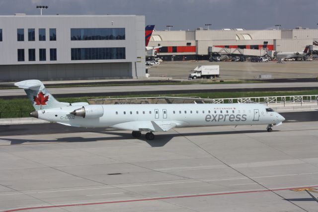 Canadair Regional Jet CRJ-700 (C-GOJZ) - Air Canada CRJ-705 pulling into Terminal F in KATL. June/28/13