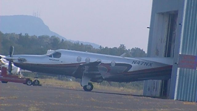 Pilatus PC-12 (N47NX) - The Pilatus PC-12 being towed into a hanger at 4B8.