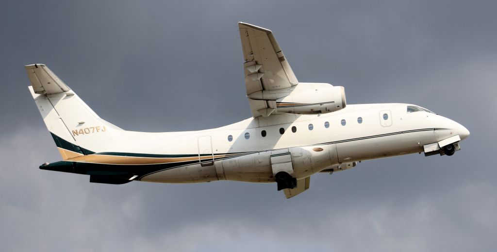 Fairchild Dornier 328JET (N407FJ) - Ultimate Jet Charter 7 - a Fairchild Dornier 328JET airborne ahead of a thunderstorm from Pryor Regional Airport, Decatur, AL - September 11, 2019.