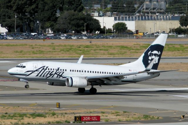 Boeing 737-700 (N617AS) - Mere seconds from touching down on San Jose Internationals runway 12L.
