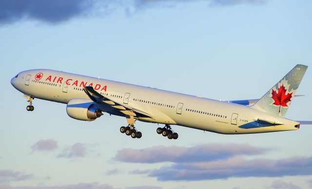 BOEING 777-300ER (C-FJZS) - AC137 roars off from RWY 05