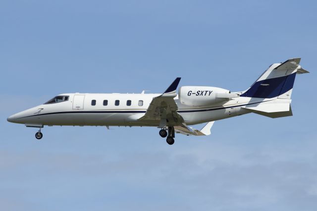 Learjet 60 (G-SXTY) - A Bombardier Lear Jet 60 approaches runway 027R at LHR.