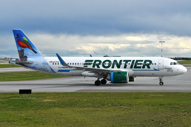 Airbus A320neo (N317FR) - Frontier (Georgia the Painted Bunting Livery) Airbus A320 heading for the terminal at YYC on July 1.