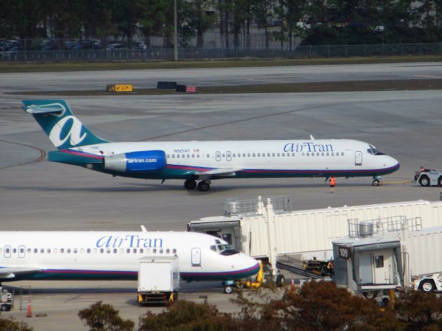 Boeing 717-200 (N9321AT) - AirTran Airways (FL) N921AT B717-200 [cn55082]br /Orlando (MCO). Being towed from the gate for departure from the AirTran pier at home-base airport Orlando (MCO).br /AirTran Airways was acquired by Southwest Airlines (WN) in May 2011 and fully subsumed by November 2014. This B717 was ultimately leased to Delta Airlines (DL) in April 2014.br /Taken from MCO Terminal Top Parking Garagebr /2012 12 12  a rel=nofollow href=http://alphayankee.smugmug.com/Airlines-and-Airliners-Portfolio/Airlines/AmericasAirlines/AirTran-Airways-FL/i-nJtCZRXhttps://alphayankee.smugmug.com/Airlines-and-Airliners-Portfolio/Airlines/AmericasAirlines/AirTran-Airways-FL/i-nJtCZRX/a