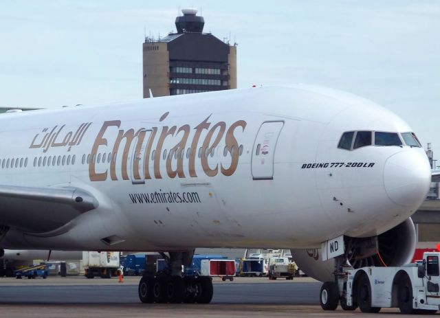 Boeing 777-200 (A6-EWD) - Emirates 777-200 at North Cargo with the tower in the background