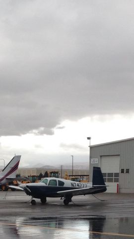 Mooney M-20 (N74777) - A Mooney on the ramp on a rainy day 