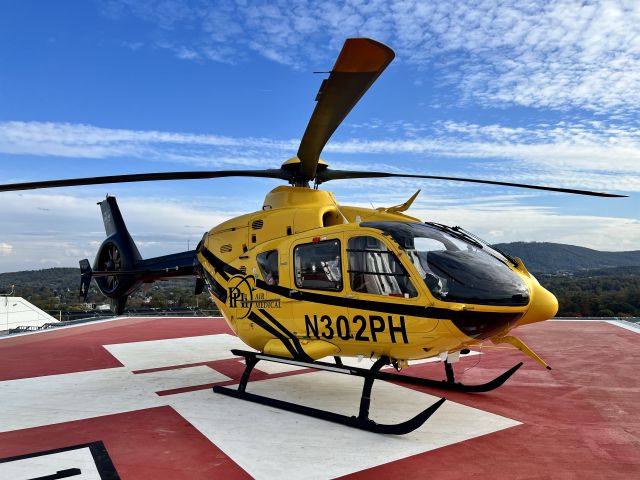 Eurocopter EC-635 (N302PH) - AirCare 4 dropping off at  UVA Medical Center brand new rooftop pad on a beautiful fall day.