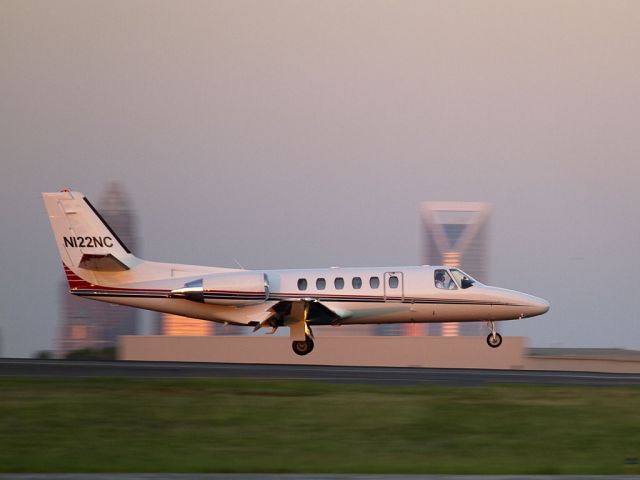 Cessna Citation II (N122NC) - This Citation landed in the creamy light of twilight on runway 18L tonight. Downtown Charlotte was sparkling in the background. A state-owned aircraft, this is your North Carolina tax dollars at work.