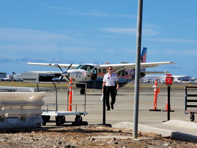 Cessna Caravan (N2150) - N2150 on the ramp at HNL, pilot just finished loading his stuff onto the plane. Love the livery on this little guy.